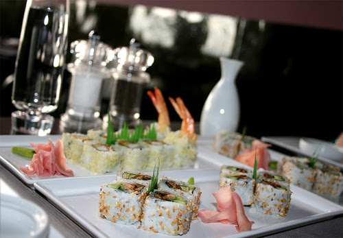 Gluten free sushi restaurant table with sushi and sake.