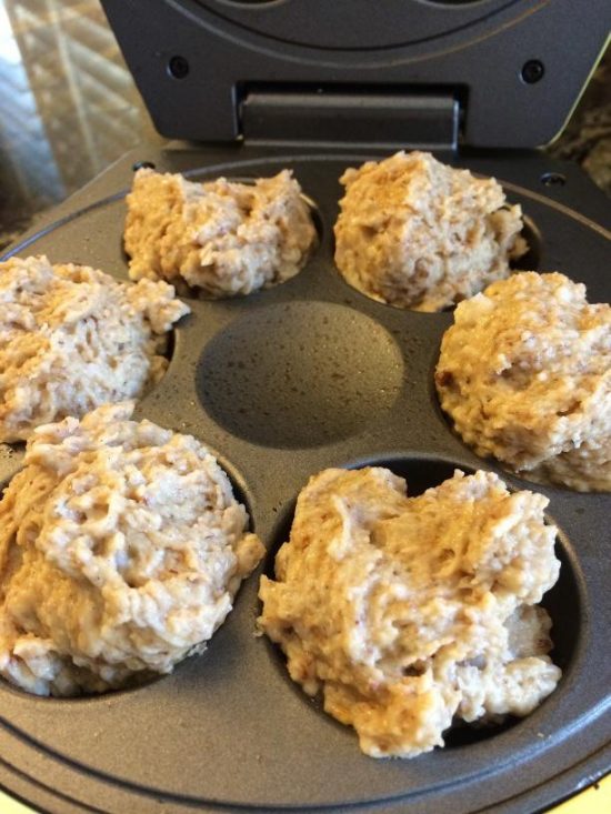 Donut batter in a donut maker before cooking.