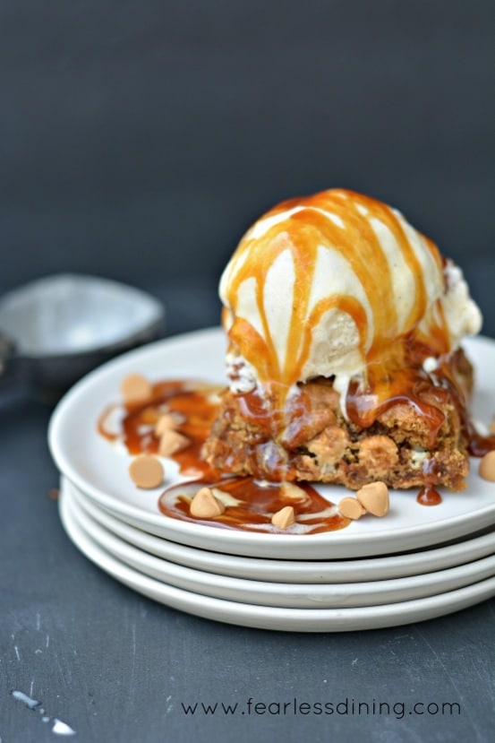 A blondie with vanilla ice cream and caramel sauce.