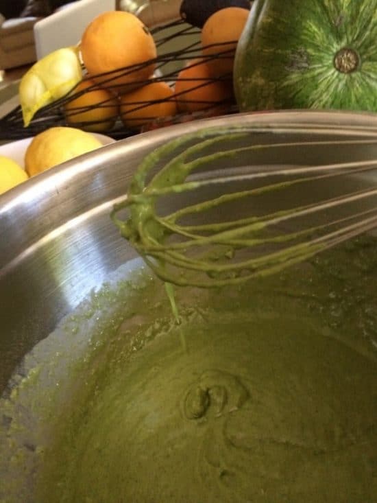 Matcha batter whisked in a bowl.