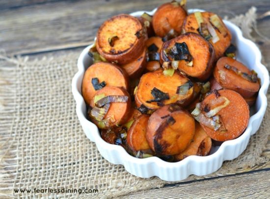 Pan fried Sweet Potato and Leeks with Honey in a white bowl.