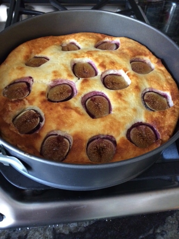 Lemon yogurt cake puffed up as it bakes in the oven.