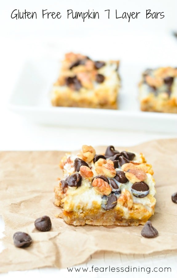 A gluten free pumpkin 7 layer bar on a paper bag.