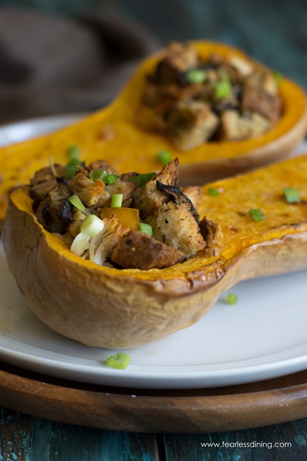 Roasted butternut squash halves stuffed with leftover stuffing and turkey