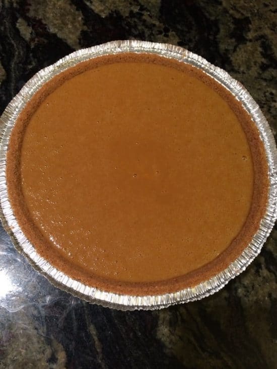 The sweet potato pie batter in a pie crust.