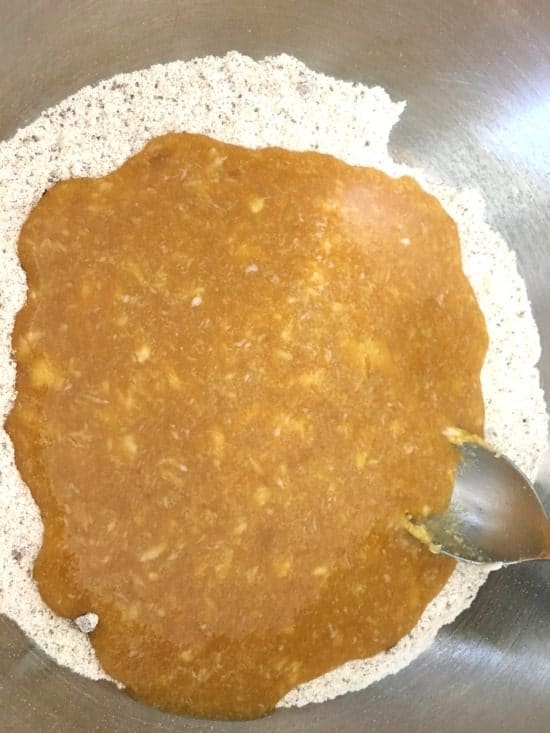 The pumpkin madeleines wet and dry ingredients in a bowl.