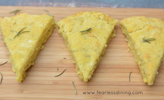 Fontina herb scones on a wooden tray.