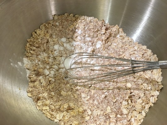 Gluten free oats mixed in with gluten free flour in a bowl
