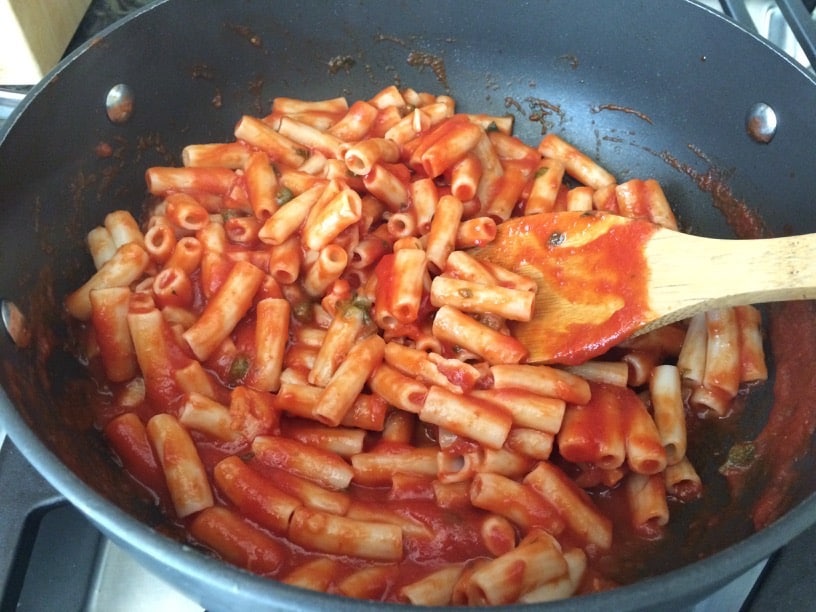 A pot of gluten free penne pasta with the marinara sauce.