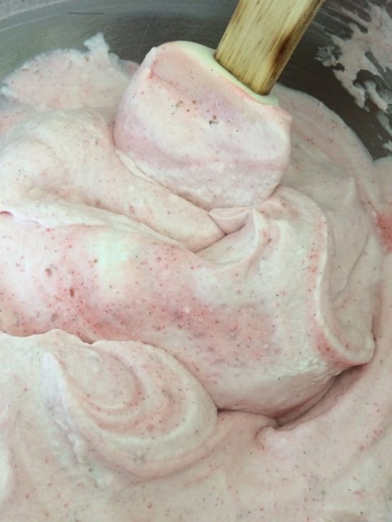 Blending the whipped cream and raspberry sauce for the mousse.