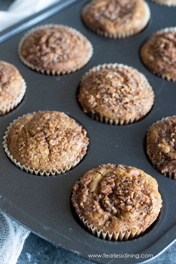 A close up of the gluten free cinnamon streusel muffins in a pan.