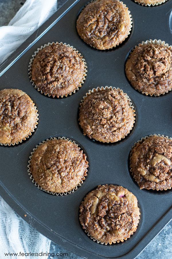 The top view of a muffin tin with the baked cinnamon streusel muffins.