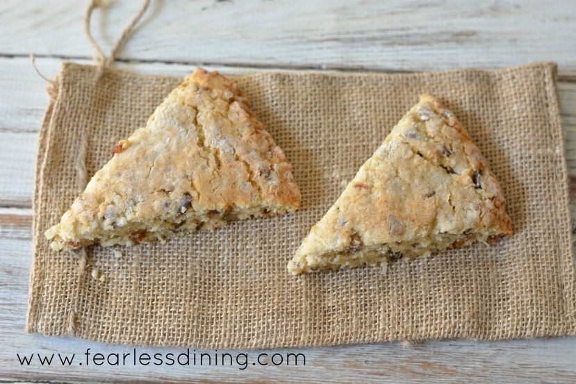 Two date scones on a burlap napkin.