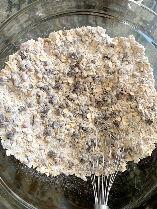 Dry cowboy cookie ingredients in a bowl.