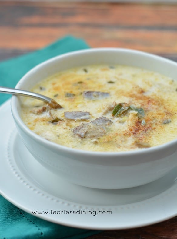 A bowl of smoked oyster chowder on the table.