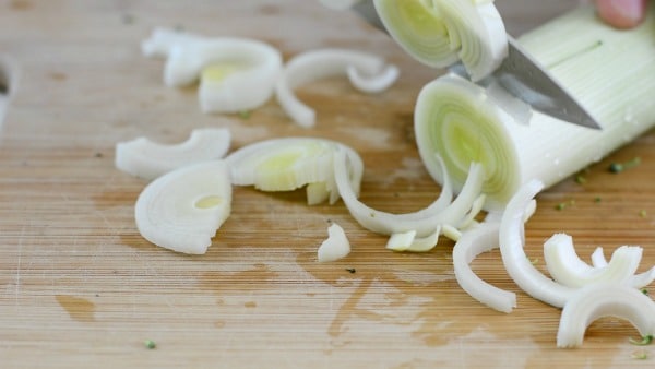 Sliced leeks on a cutting board.