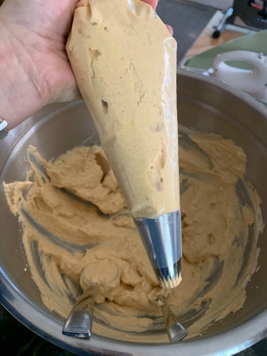 A piping bag full of pumpkin mousse.