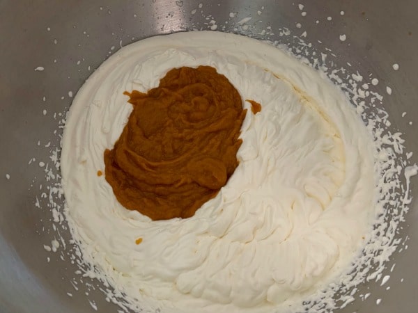 The pumpkin mixture in the whipped cream.