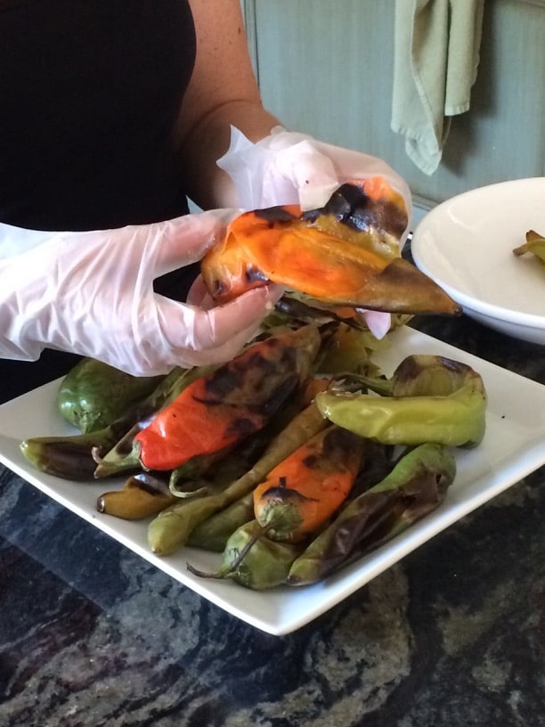 Peeling hatch chiles with gloves on.