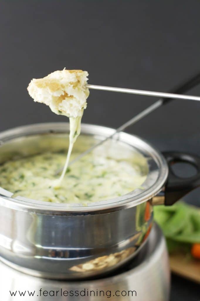 Bread with a string of melted cheese. 