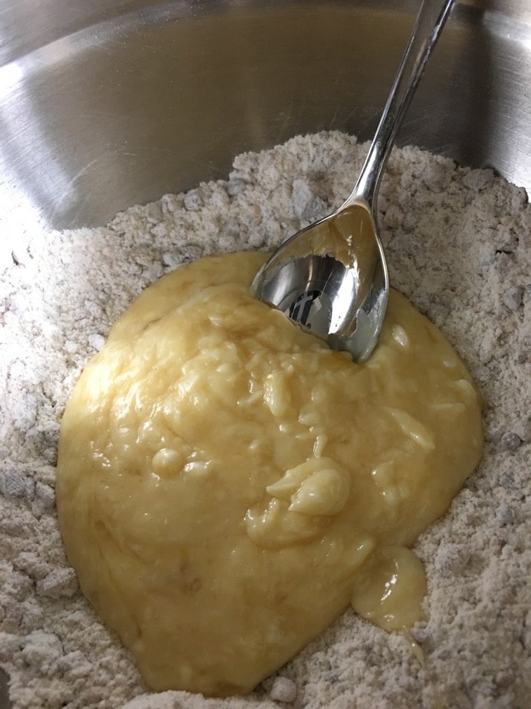 The wet and dry ingredients in a bowl.