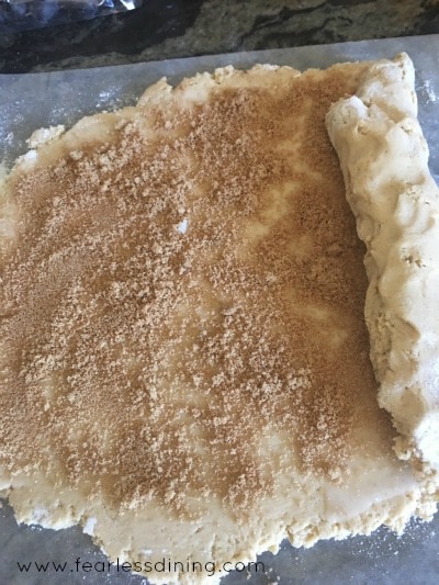 Dough Rolling with the cinnamon layer.