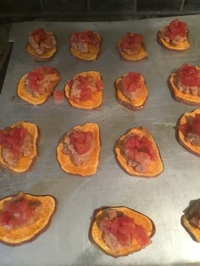 Beans and salsa on sliced sweet potatoes.