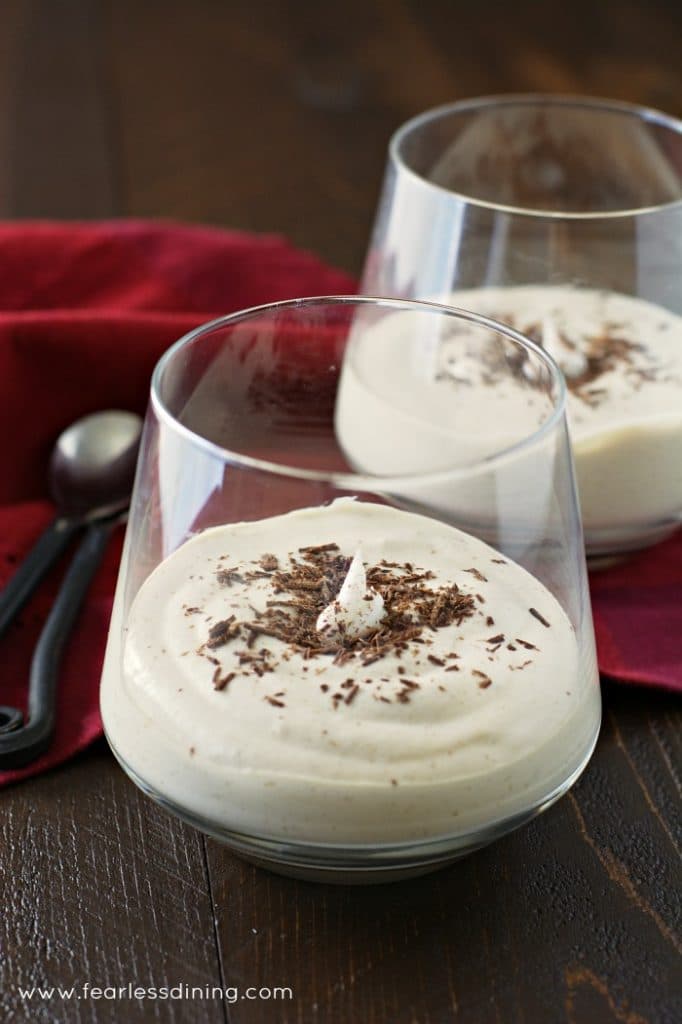 White Chocolate Mocha Mousse in glasses with spoons in the background.