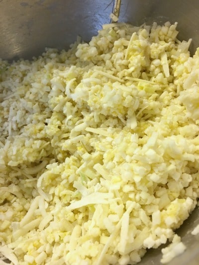 Cauliflower Cheddar Pancake ingredients mixed in a bowl.