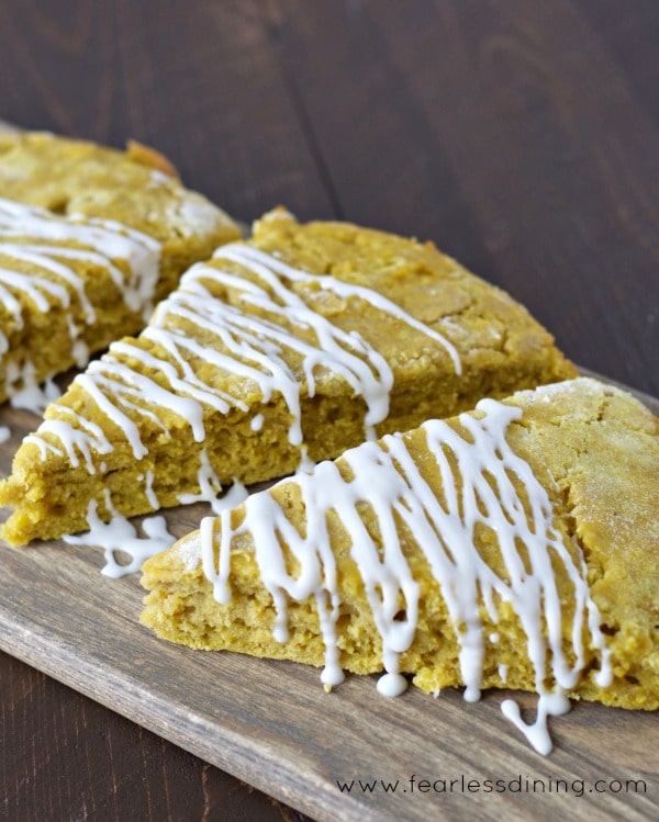 Sweet potato scones on a wooden cutting board.