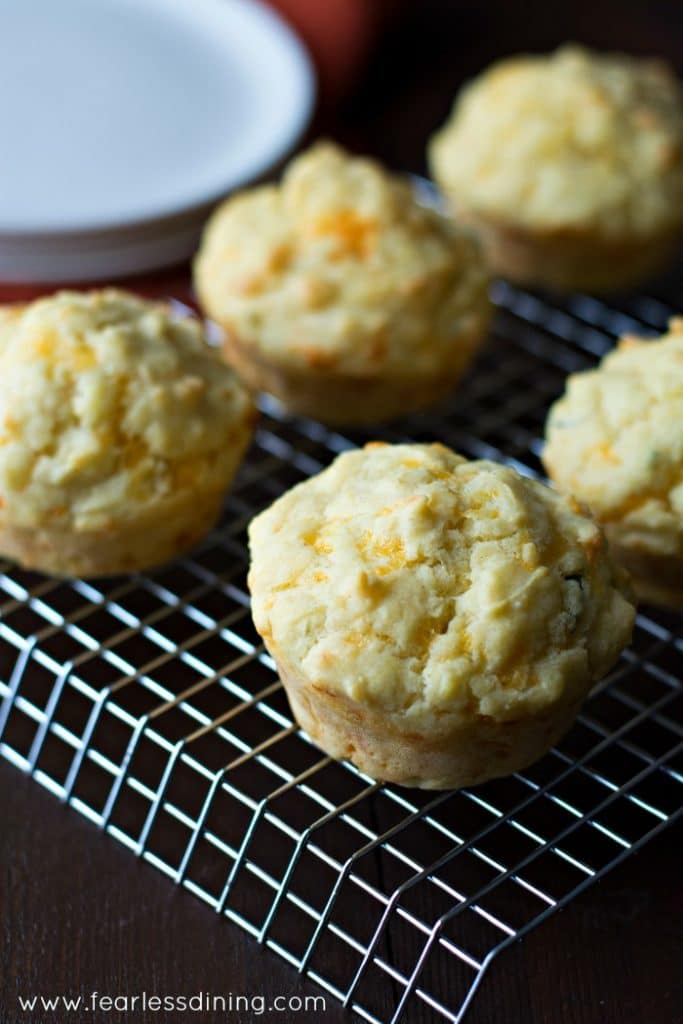 Close up picture of Gluten Free Cheddar Herb Muffins on a cooling rack.
