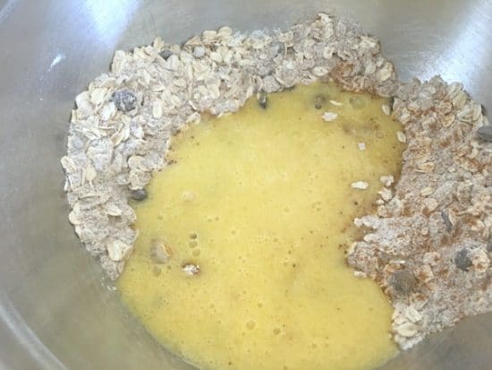 Wet and dry ingredients in a mixing bowl.