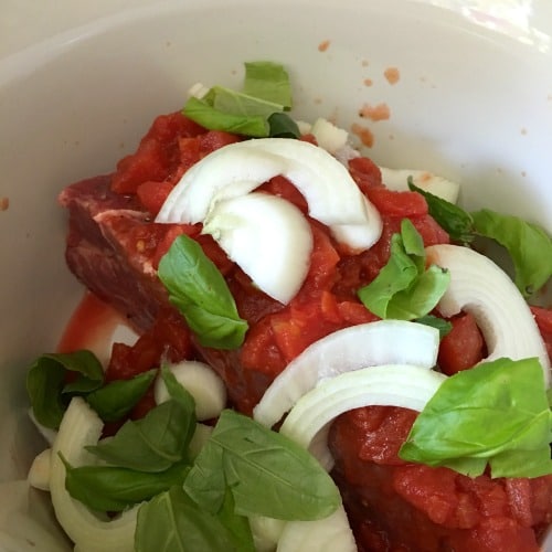 All of the ingredients in the slow cooker, ready to cook.