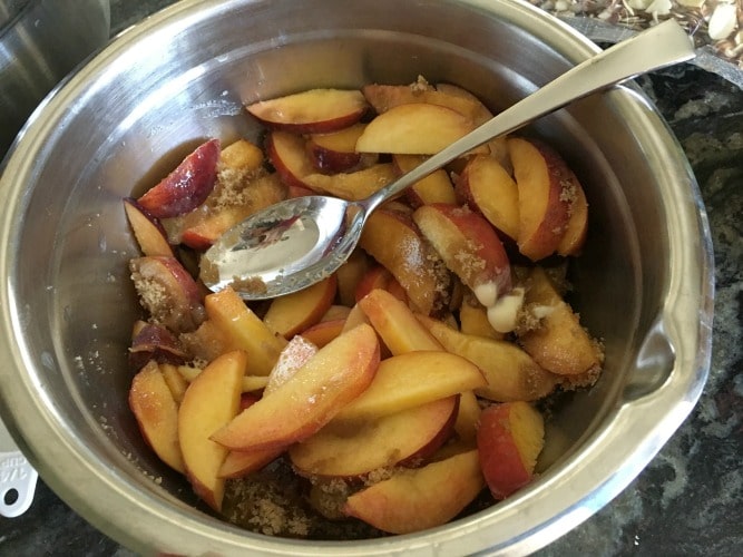 Peaches and brown sugar in a bowl.