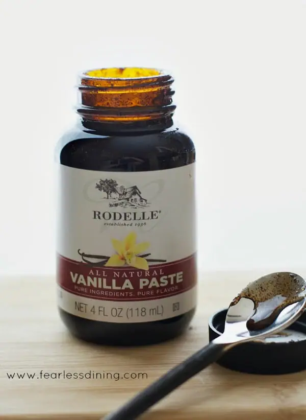 glass bottle of Rodelle Vanilla Paste sitting on a cutting board