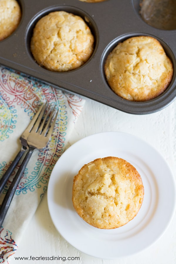 A top view of a French apple cake on a small white plate.