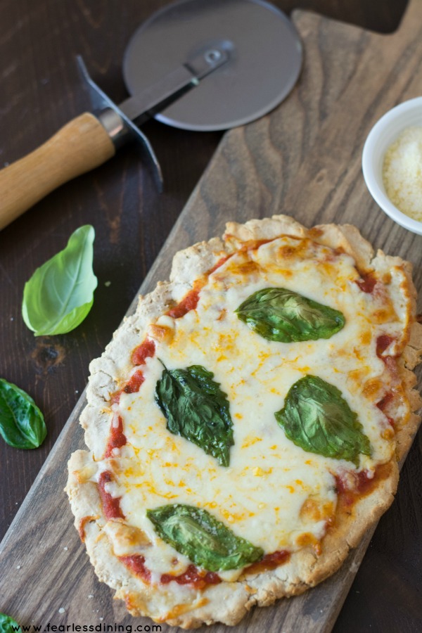 Gluten free flatbread pizza with fresh tomatoes and basil.