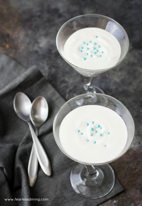 The top view of French Vanilla Mousse in martini glasses. Spoons are next to the glasses