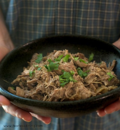Someone holding a bowl of Slow Cooker Pulled Pork