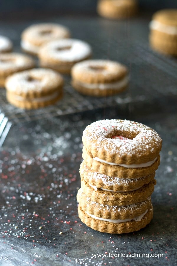 A stack of three gluten free linzer cookies.