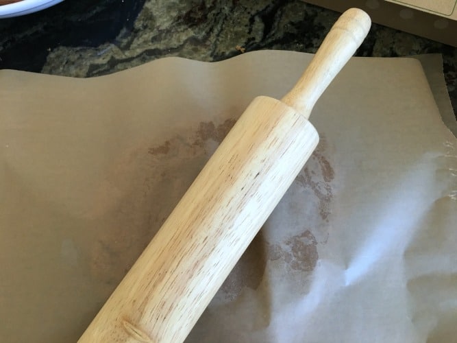  rolling out the dough with a rolling pin