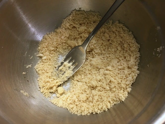 Almond meal crust ingredients in a bowl.