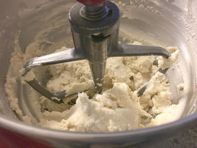 Cookie batter in a stand mixer.