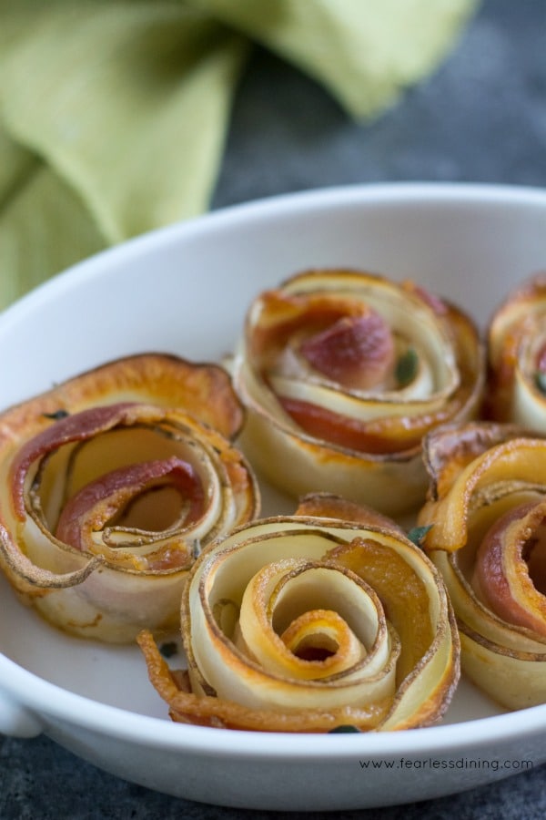 Rolled Potato Bacon Roses in a baking dish.