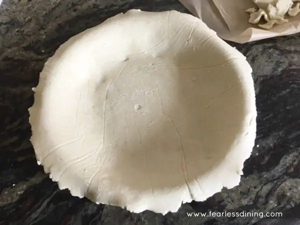 unbaked Gluten free pie crust dough in a pie tin