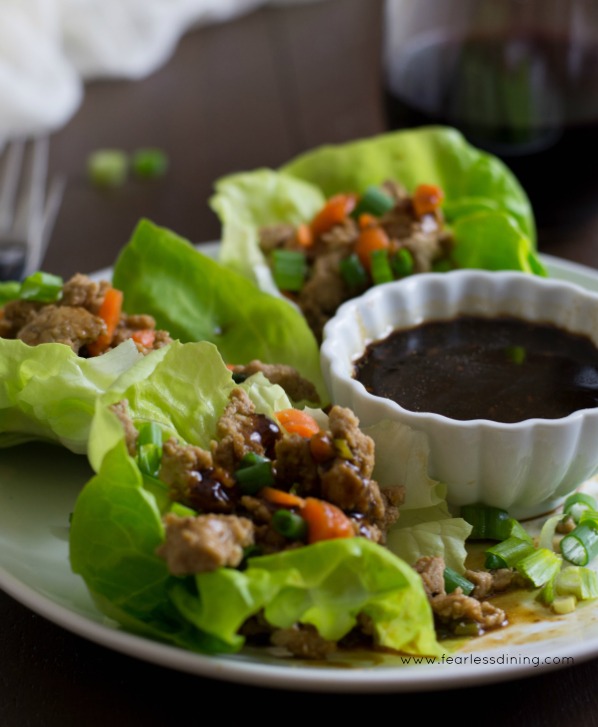 A close up photo of Gluten Free Asian Lettuce Wraps with dipping sauce