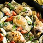 A Pinterest pin of the chicken legs in a skillet.