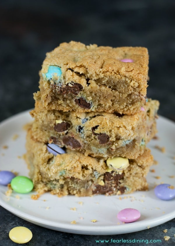 Gluten free peanut butter cookie bars stacked up on a plate.