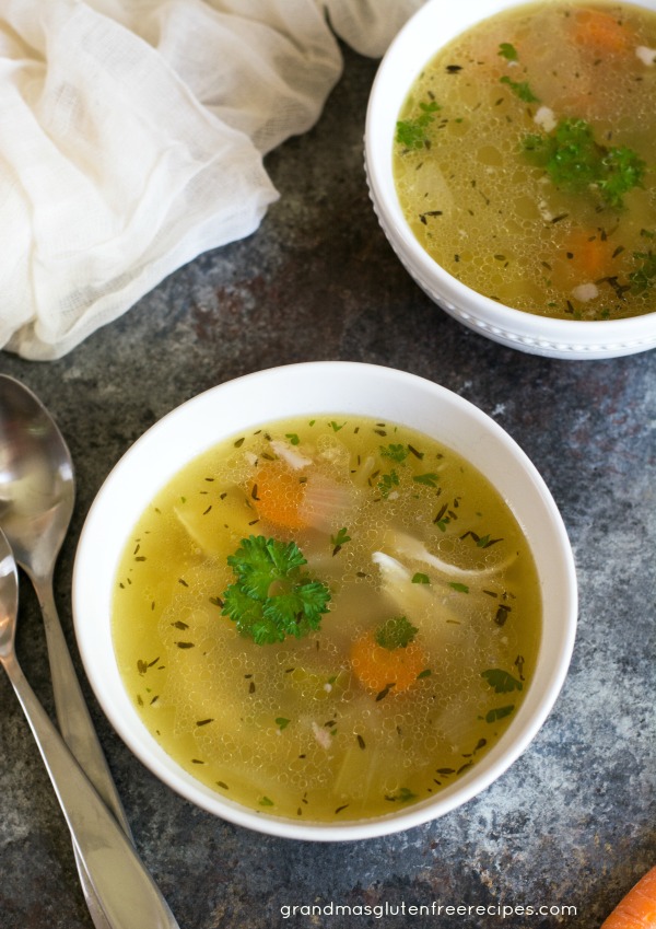 The top view of two bowls of grandma's chicken soup.