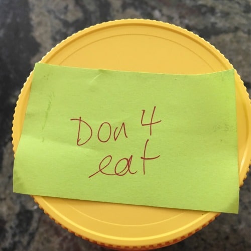 Jar of peanut butter with Don't Eat Me Sign